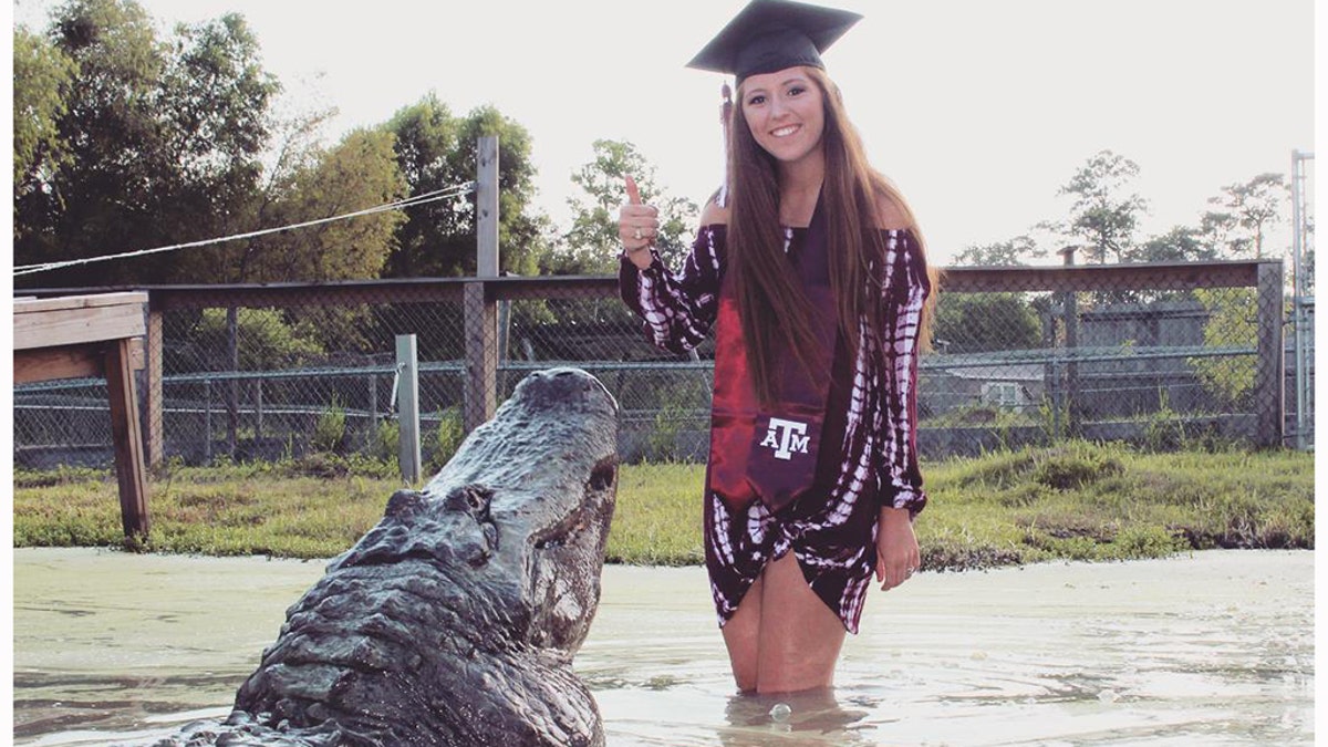 Unusual graduation photos of Makenzie with a Gator.