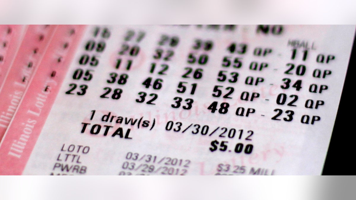 A Mega Millions lottery ticket purchased in Chicago, Thursday, March 29, 2012, shows the drawing date of Friday, March 30, 2012.