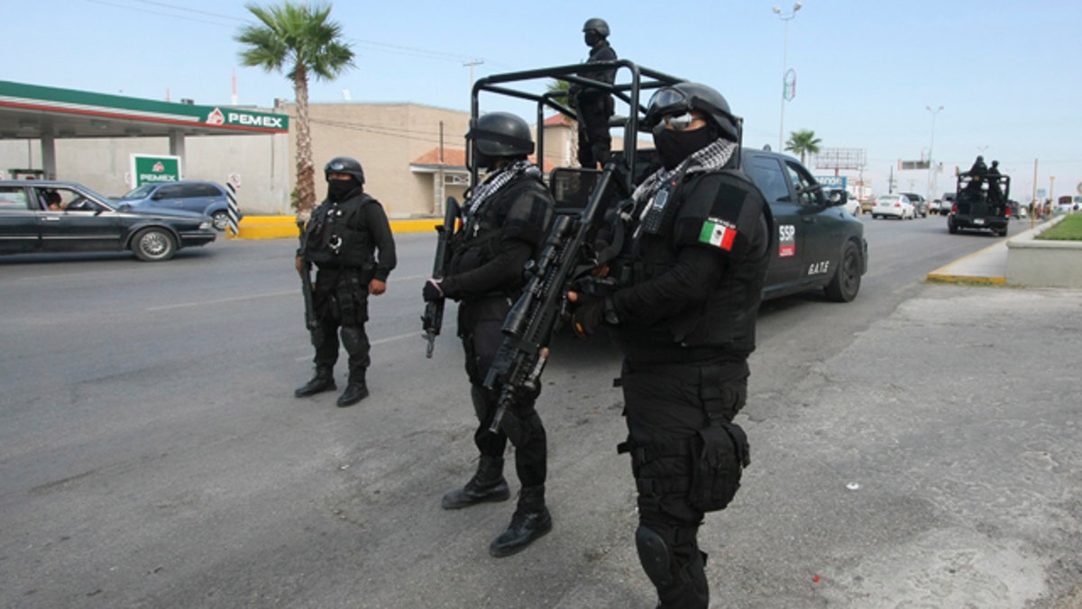 Rapid response Coahuila state police stand at a checkpoint