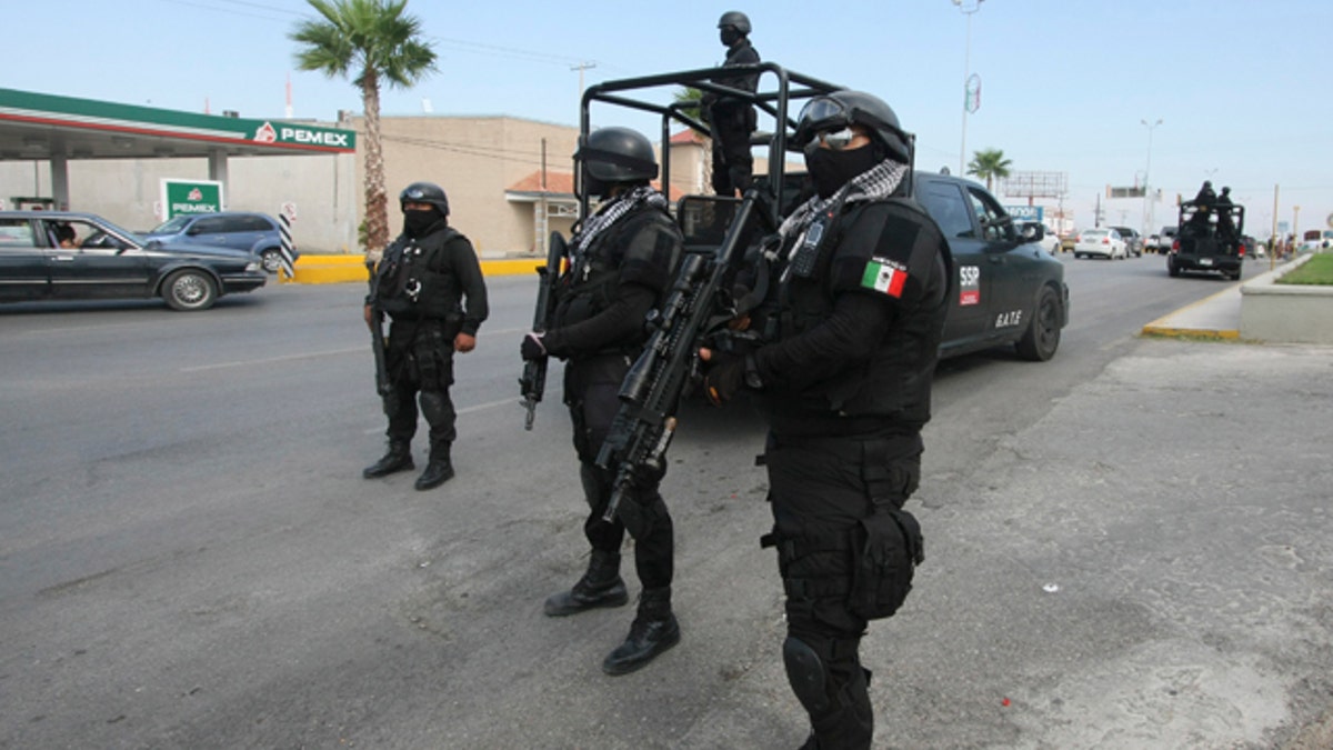 Rapid response Coahuila state police stand at a checkpoint