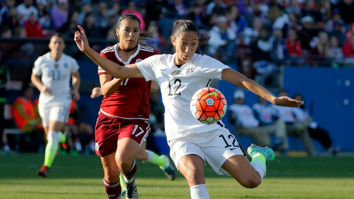 United States forward Christen Press (12) takes a shot at the goal as Mexico midfielder Veronica Perez (17) watches in the second half of a CONCACAF Olympic qualifying tournament soccer match, Saturday, Feb. 13, 2016, in Frisco, Texas. The U.S. won 1-0. (AP Photo/Tony Gutierrez)