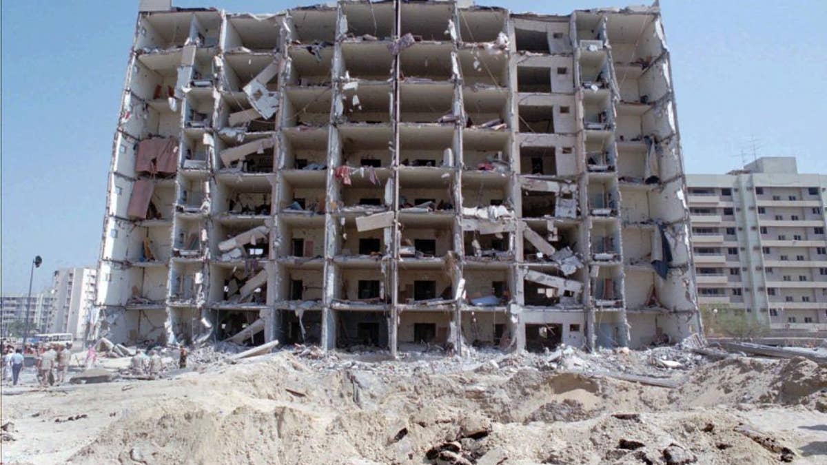 Destroyed Khobar Towers and crater in Saudi Arabia