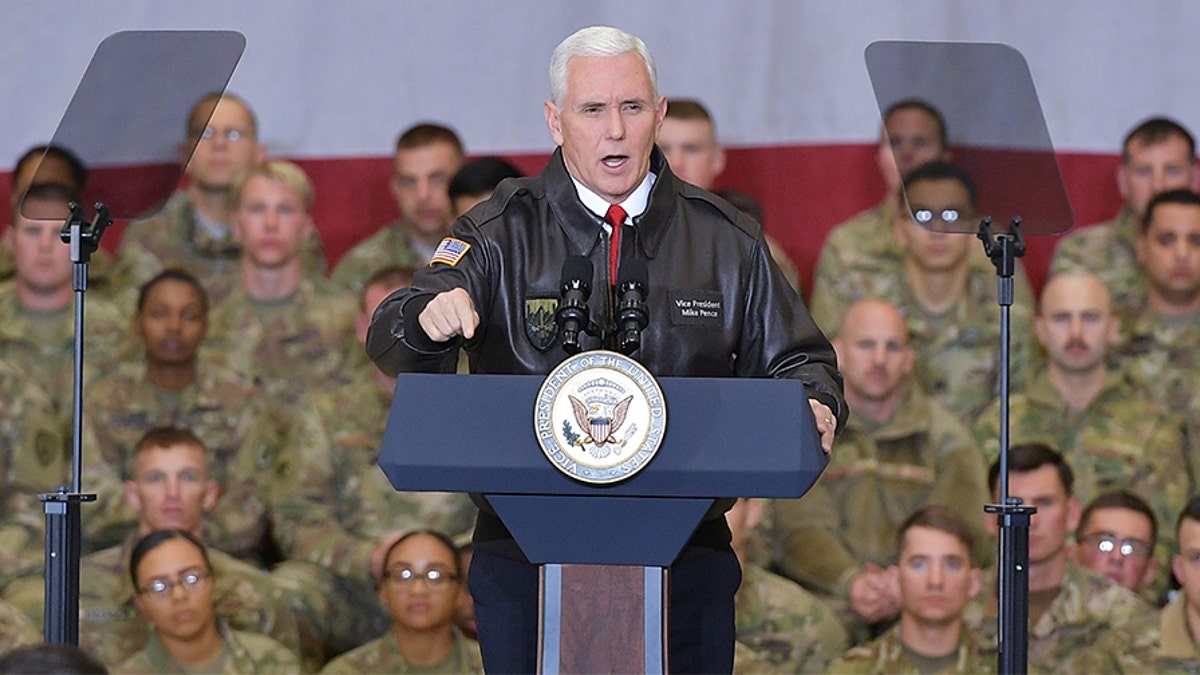 U.S. Vice President Mike Pence speaks to troops in a hangar at Bagram Air Field in Afghanistan on December 21, 2017. REUTERS/Mandel Ngan/Pool - RC11D00E3B50