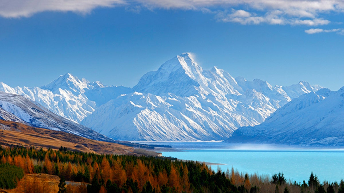 38773AM00: Aoraki / Mount Cook (3754m) and Lake Pukaki in winter. Mt La Perouse (3078m) left, Tasman Valley and Burnett Mountains Range right. Panorama with late autumn colours, Aoraki / Mount Cook National Park, MacKenzie District, New Zealand. Photocredit to be given as Rob Suisted / www.naturespic.co.nz.