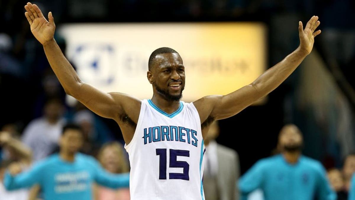 CHARLOTTE, NC - APRIL 25: Kemba Walker #15 of the Charlotte Hornets reacts to the crowd against the Miami Heat during game four of the Eastern Conference Quarterfinals of the 2016 NBA Playoffs at Time Warner Cable Arena on April 25, 2016 in Charlotte, North Carolina. NOTE TO USER: User expressly acknowledges and agrees that, by downloading and or using this photograph, User is consenting to the terms and conditions of the Getty Images License Agreement. (Photo by Streeter Lecka/Getty Images)