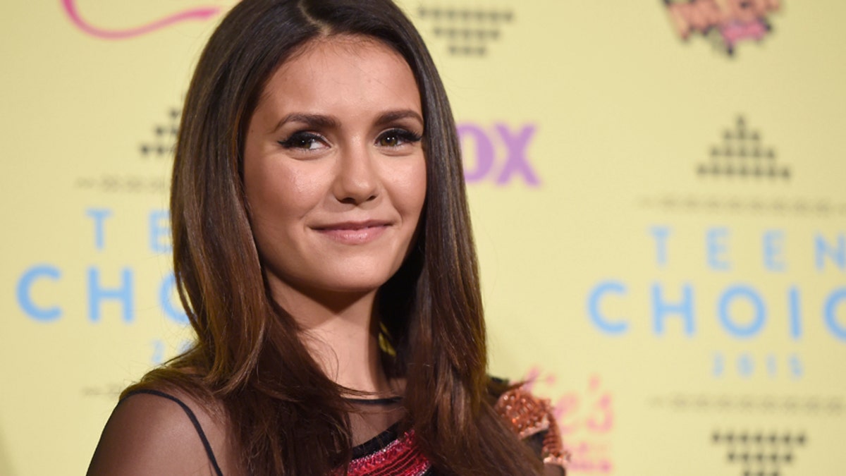 Nina Dobrev, winner of the choice TV  actress: sci-fi fantasy award for The Vampire Diaries, poses in the press room at the Teen Choice Awards at the Galen Center on Sunday, Aug. 16, 2015, in Los Angeles. (Photo by Chris Pizzello/Invision/AP)