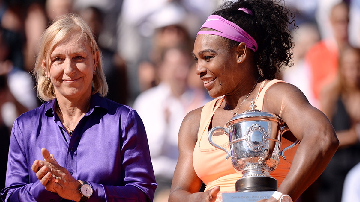 Serena Williams is applauded by Martina Navratilova after beating Lucie Safarova in the women's singles final on day fourteen of the French Open at Roland Garros on June 6th, 2015 in Paris, France