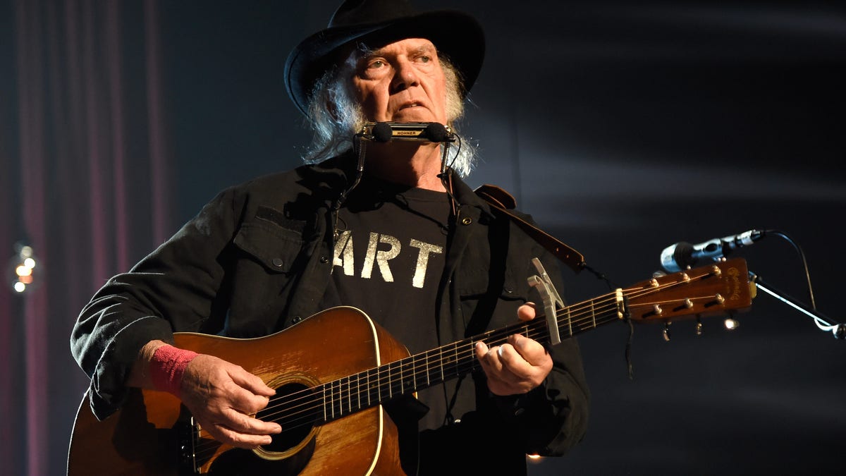 Neil Young plays guitar