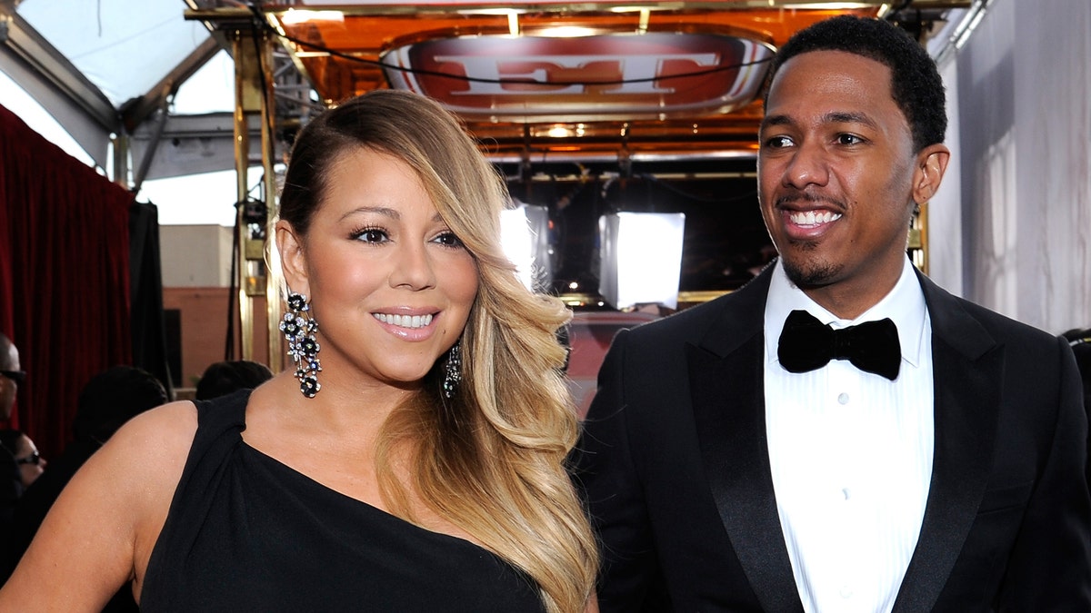LOS ANGELES, CA - JANUARY 18:  Singer-actress Mariah Carey and TV personality Nick Cannon attend the 20th Annual Screen Actors Guild Awards at The Shrine Auditorium on January 18, 2014 in Los Angeles, California.  (Photo by Kevork Djansezian/Getty Images)