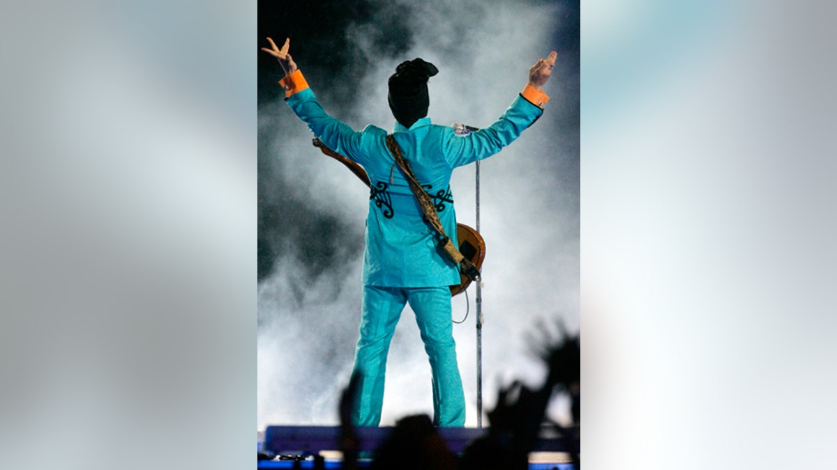 FILE - In this Feb. 4, 2007 file photo, Prince performs during the halftime show at Super Bowl XLI at Dolphin Stadium in Miami. Prince's publicist has confirmed that Prince died at his home in Minnesota, Thursday, April 21, 2016. He was 57. (AP Photo/Chris Carlson, File)