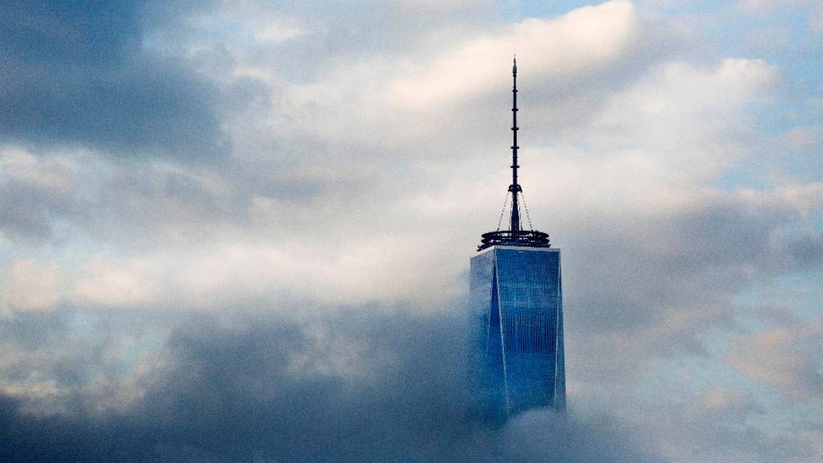 This April 21, 2015, file photo, shows the top floors of New York's One World Trade Center in Lower Manhattan. The observatory atop the 104-story skyscraper is scheduled to open to the public on May 29. (AP Photo/Mark Lennihan, File)