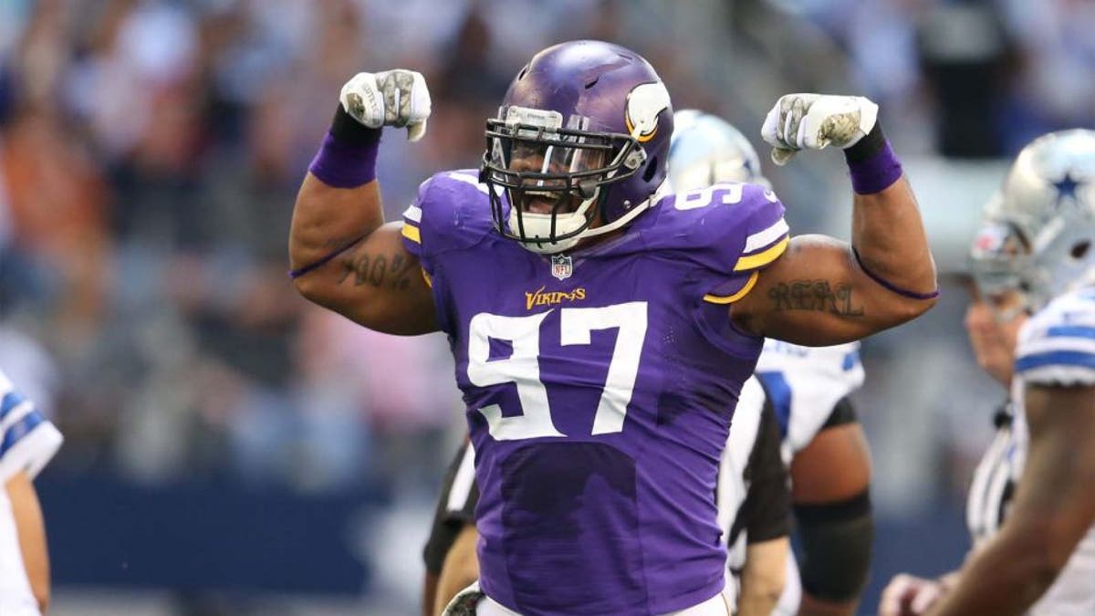 Minnesota Vikings defensive end Everson Griffen (97) celebrates his sack on Dallas Cowboys quarterback Tony Romo on Nov. 3, 2013.