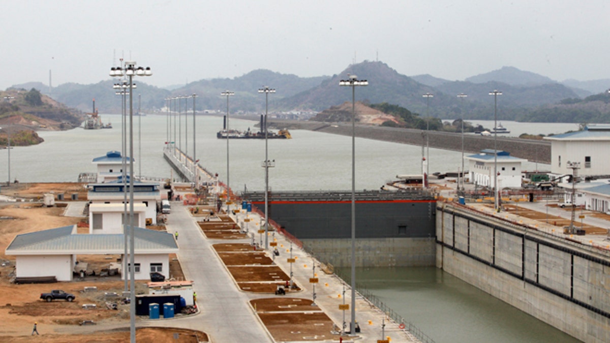 A view of Panama Canal expansion project during a tour oby Panama's President Juan Carlos Varela in Panama City, Friday, March 18, 2016. A third set of locks will allow the passage of Post-Panamax vessels or container ships much too big to fit through the older locks. (AP Photo/Arnulfo Franco)