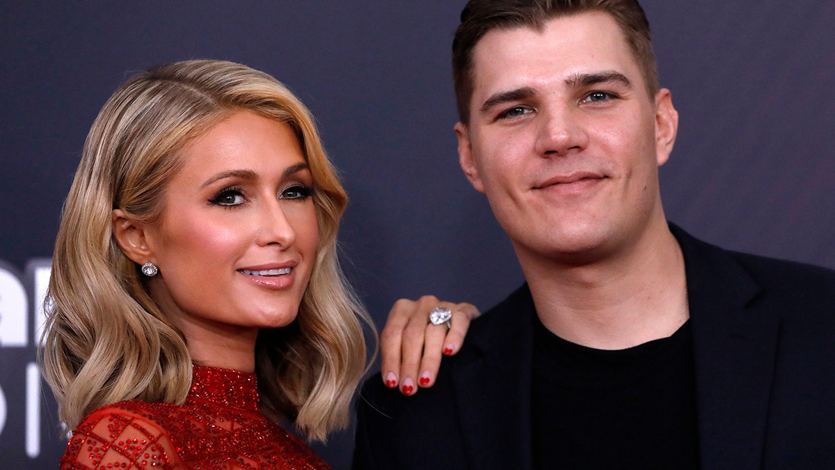 Paris Hilton and Chris Zylka arrive at the 2018 iHearRadio Music Awards in Los Angeles on March 11, 2018.