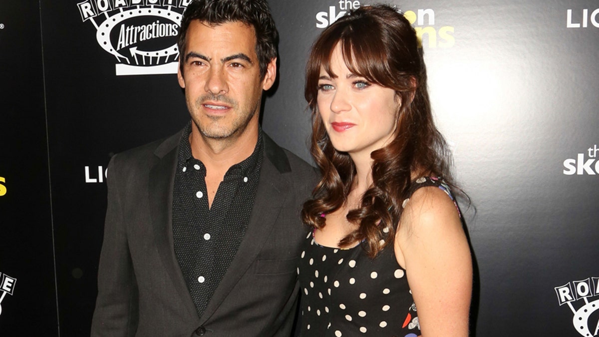 In this Sept. 10, 2014 file photo, Jacob Pechenik, left, and Zooey Deschanel  attend 