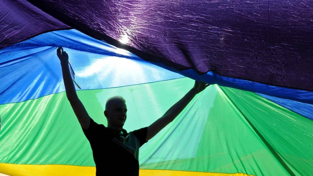 Ontario Canada teacher LGBTQ trans giant prosthetic breasts