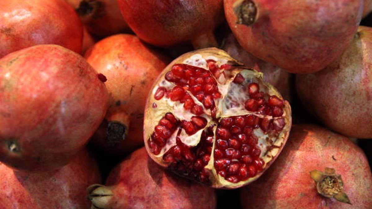 LONDON, ENGLAND - OCTOBER 21: Fresh pomegranates are displayed at the World Fruit and Vegetable Show in the ExCeL exhibition centre on October 21, 2009 in London, England. The trade show is the UK's main exhibition for all aspects of the fruit and vegetable industry with over 300 exhibitors from around the world. Today the Royal Society urged the Government to invest 2 billion GBP into research for ways to improve crop production and to prevent world hunger. The Royal Society has said that global food production will have to increase by approximately 50 percent in 40 years. (Photo by Oli Scarff/Getty Images)