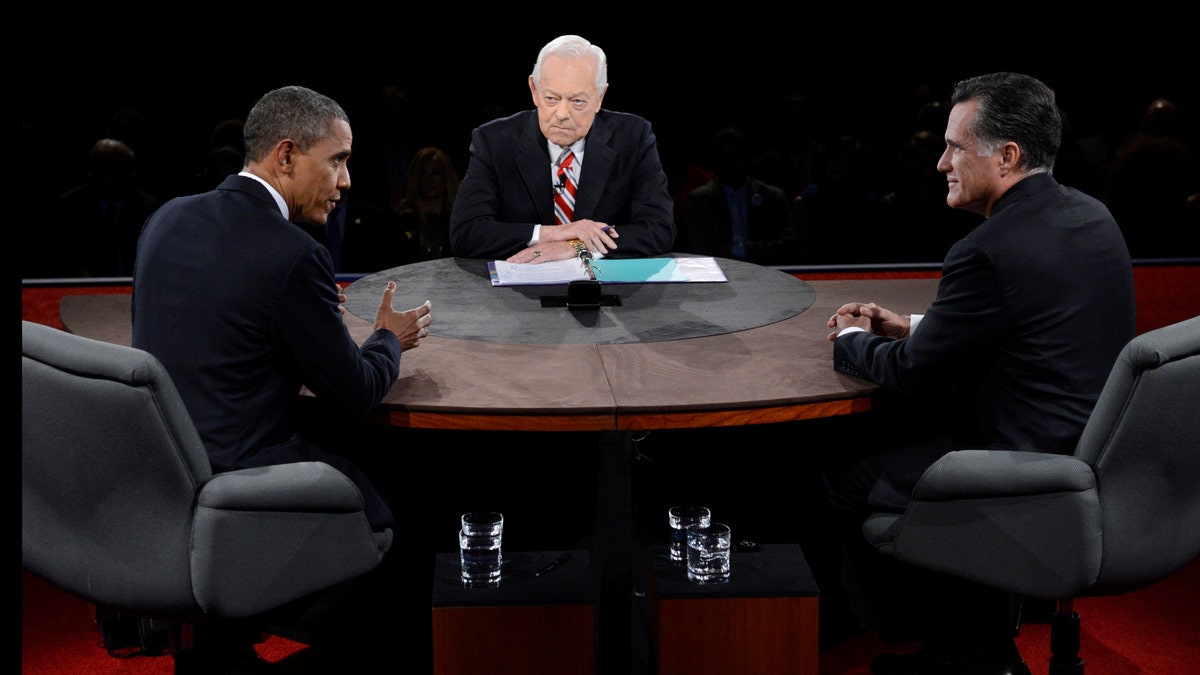 President Barack Obama speaks as Republican presidential nominee Mitt Romney and moderator Bob Schieffer listen during the third presidential debate at Lynn University, Monday, Oct. 22, 2012, in Boca Raton, Fla. (AP Photo/Pool-Michael Reynolds)
