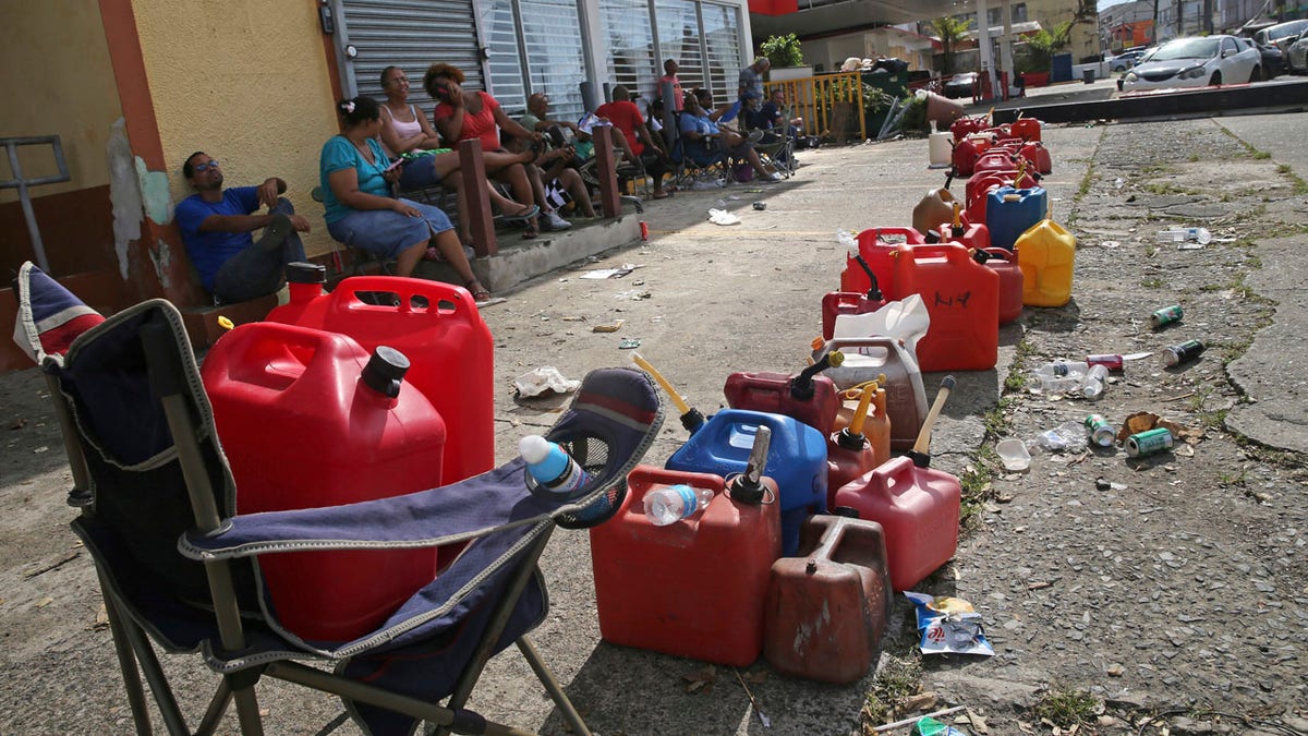 Puerto Rico Hurricane Maria People Gas Cans AP FBN