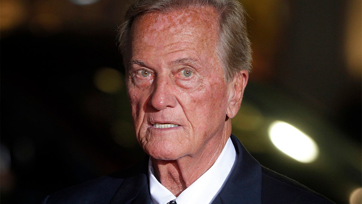 Singer Pat Boone arrives as a guest for a screening in honor of the 
