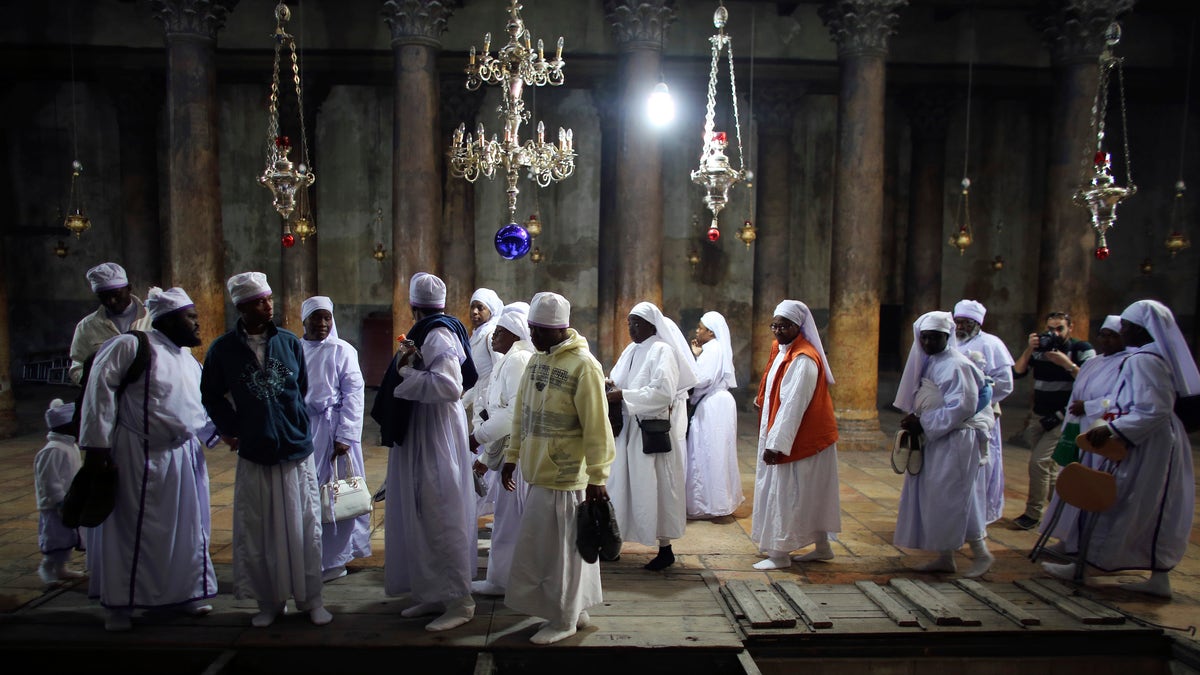 Nigerian pilgrims visit the Church of Nativity, the site revered by Christians as Jesus' birthplace, in the West Bank town of Bethlehem December 24, 2012. REUTERS/Ammar Awad (WEST BANK - Tags: RELIGION)