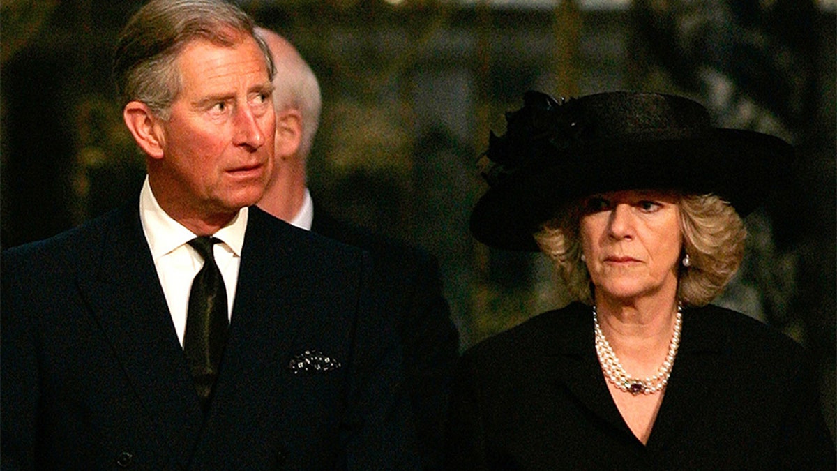 Prince Charles and Camilla Parker-Bowles attend a service in memory of Pope John Paul II at London's Westminster Cathedral.  Britain's Prince Charles (L) and Camilla Parker-Bowles attend a service in memory of Pope John Paul II at London's Westminster Cathedral April 4, 2005. Pope John Paul will be buried in St. Peter's Basilica on April 8, Catholic cardinals decided on Monday as they began to plan the Church's future after the death of the man who led it for a quarter century. Prince Charles has postponed his marriage to long-time lover Camilla Parker Bowles from Friday to Saturday so that he can attend the funeral of Pope John Paul in Rome. REUTERS/Kieran Doherty - RP6DRMSAJJAB