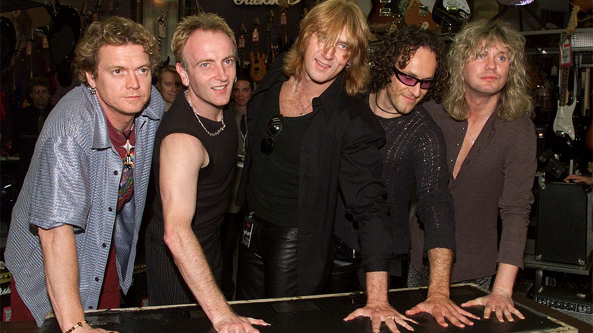 Members of the British rock group Def Leppard placed their handprints in cement during the private ceremony at Hollywood's RockWalk ceremony September 5, 2000 in Hollywood. Shown (L-R) are Rick Allen, Phil Collen, Joe Elliott, Vivian Campbell and Rick Savage. The band was originally formed in 1977 and has sold over 31 million albums in the United States alone.

FSP - RP2DRICIOIAA