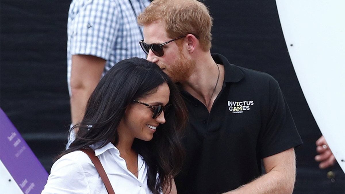 Britain's Prince Harry (R) arrives with girlfriend Meghan Markle at the wheelchair tennis event during the Invictus Games in Toronto, Ontario, Canada September 25, 2017. Picture taken September 25, 2017. REUTERS/Mark Blinch - RC140336D910