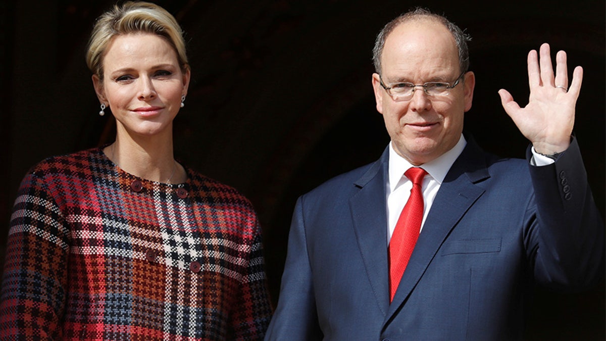 Prince Albert II of Monaco and his wife Princess Charlene stand on the palace balcony during the traditional Sainte Devote procession in Monaco, January 27, 2018.     REUTERS/Eric Gaillard - RC1BB46ACA80