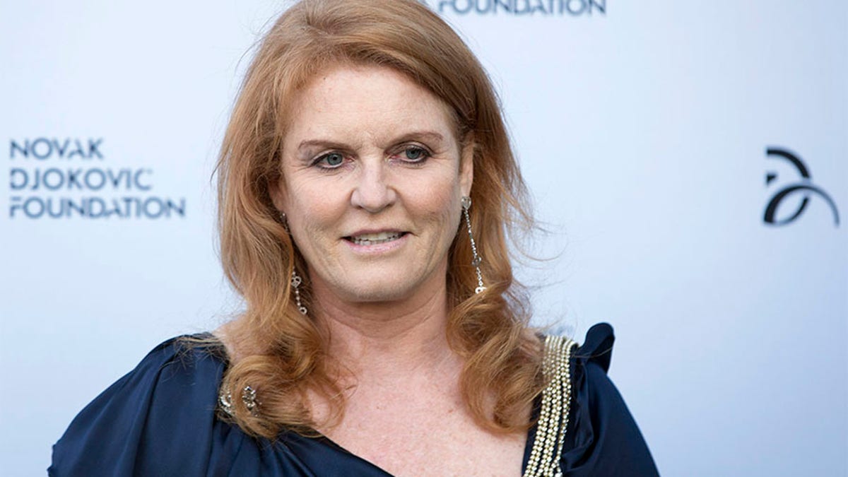 Britain's Sarah Ferguson, the Duchess of York, poses for photographers as she arrives at a fundraising dinner for the Novak Djokovic Foundation in London July 8, 2013.   REUTERS/Neil Hall   (BRITAIN - Tags: SPORT TENNIS ENTERTAINMENT SOCIETY PROFILE HEADSHOT ROYALS) - GM1E9790CWB01