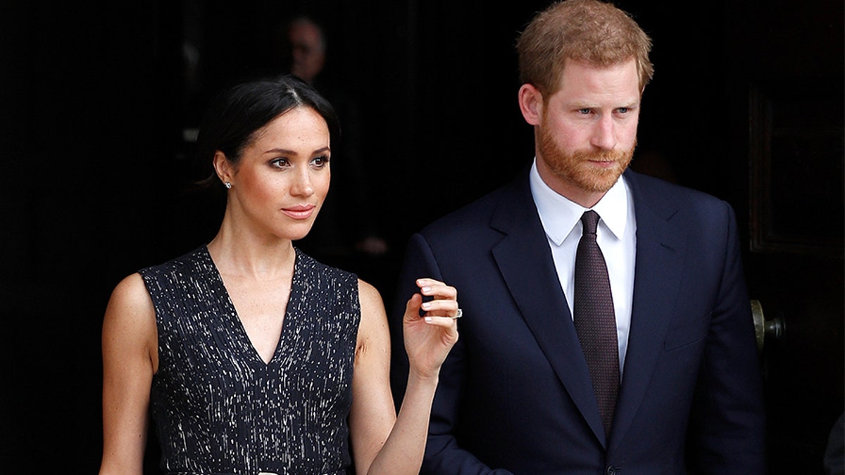 Britain's Prince Harry and his fiancee Meghan Markle leave a service at St Martin-in-The Fields to mark 25 years since Stephen Lawrence was killed in a racially motivated attack, in London, Britain, April 23, 2018. REUTERS/Peter Nicholls - RC1E027934F0