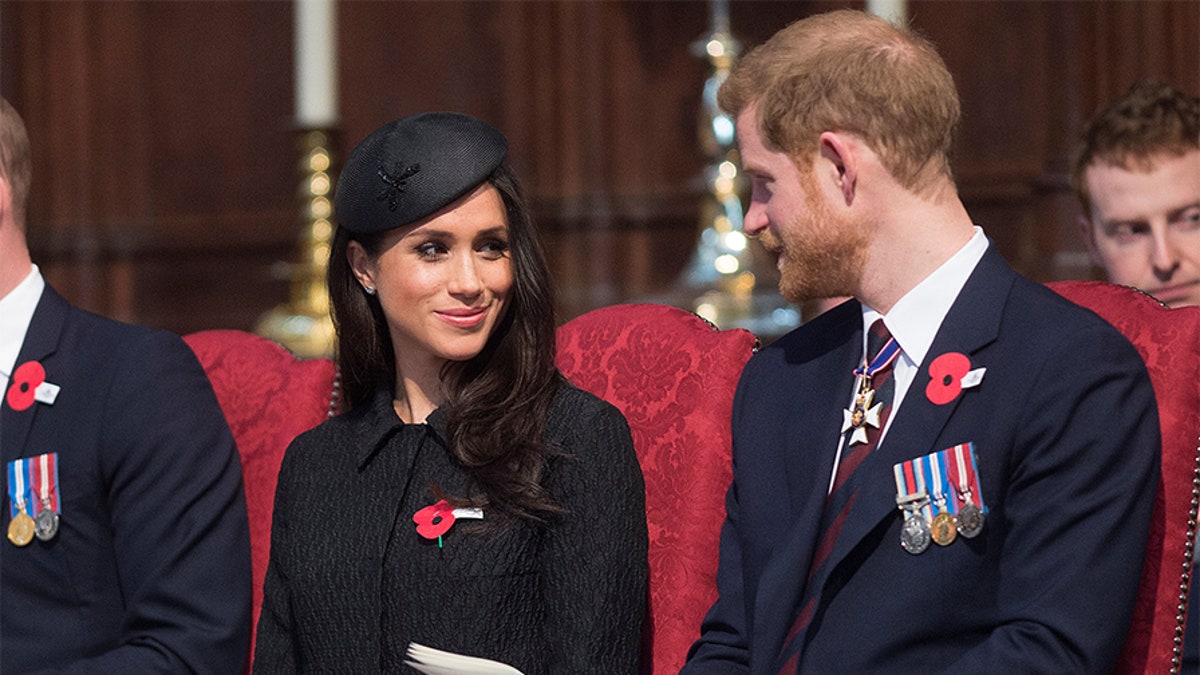 Britain's Prince Harry and his fiancee Meghan Markle attend a Service of Thanksgiving and Commemoration on ANZAC Day at Westminster Abbey in London, Britain, April 25, 2018. Eddie Mulholland/Pool via Reuters - RC12F7955700