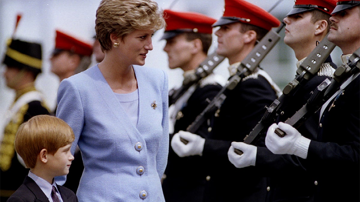 Princess of Wales, Lady Diana, inspects with her eight-year-old son, Prince Harry, troops at the regiment's base of Bergen-Hohne, July 29. The soldiers of the 