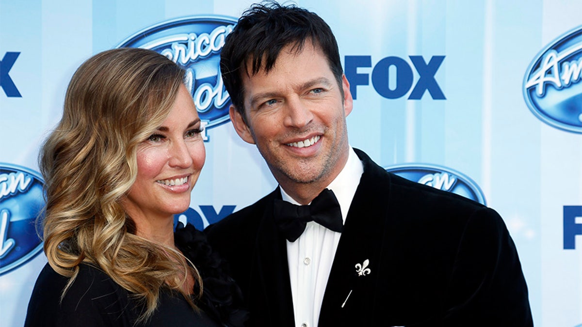 Singer Harry Connick, Jr. and his wife Jill Goodacre arrive at the American Idol XIII 2014 Finale in Los Angeles, California May 21, 2014.  REUTERS/Danny Moloshok  (UNITED STATES-Tags: ENTERTAINMENT)(AMERICANIDOL-ARRIVALS) - TB3EA5L1TK1FZ