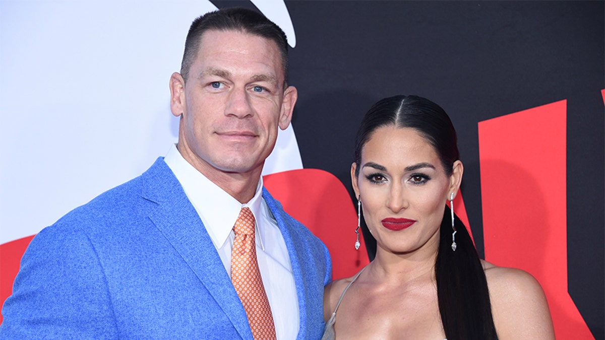 Cast member John Cena (L) and Nikki Bella attend the premiere of 