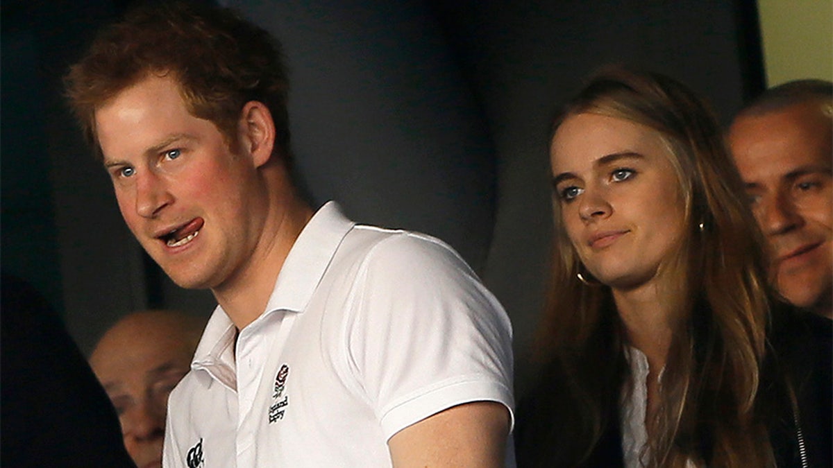 Britain's Prince Harry and Cressida Bonas attend England's Six Nations international rugby union match against Wales at Twickenham in London March 9, 2014. REUTERS/Stefan Wermuth (BRITAIN - Tags: SPORT RUGBY ROYALS) - GM1EA3A04PZ01