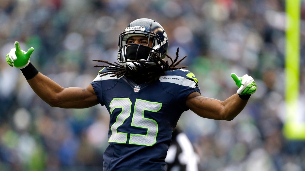 Seattle Seahawks' Richard Sherman reacts to a play against the St. Louis Rams in the first half of an NFL football game, Sunday, Dec. 30, 2012, in Seattle. (AP Photo/Elaine Thompson)