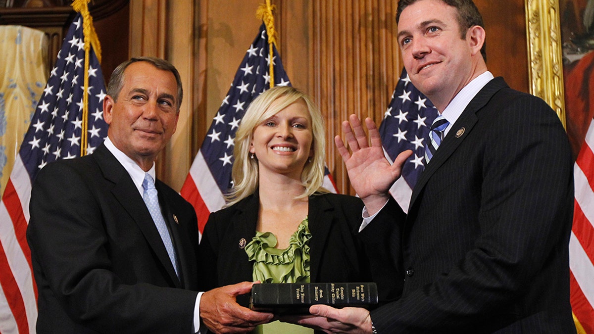 House Speaker John Boehner of Ohio, left, administers the House oath to Rep. Duncan Hunter, R-Calif, Mock swearing-in ceremony on Capitol Hill. Jan 5 2011