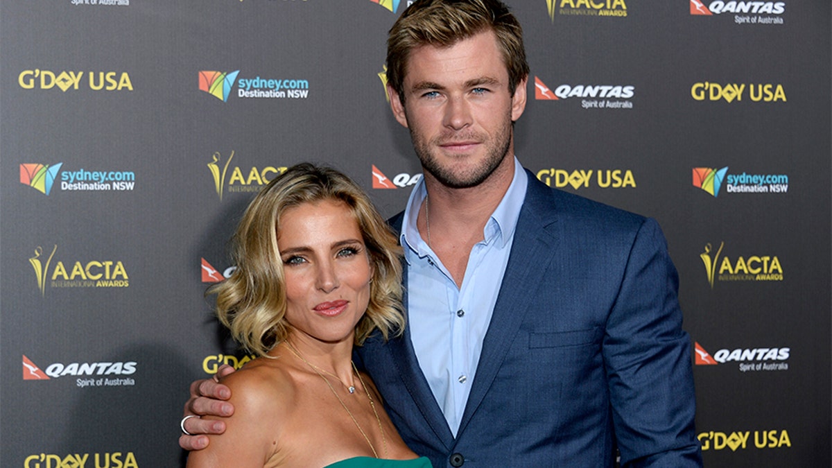 Actor Chris Hemsworth and wife Elsa Pataky pose at the 2015 G'Day USA Los Angeles Gala honoring Hemsworth with an Excellence in Film Award, at the Hollywood Palladium in Los Angeles, California January 31, 2015. REUTERS/Kevork Djansezian  (UNITED STATES - Tags: ENTERTAINMENT) - GM1EB210U7N01