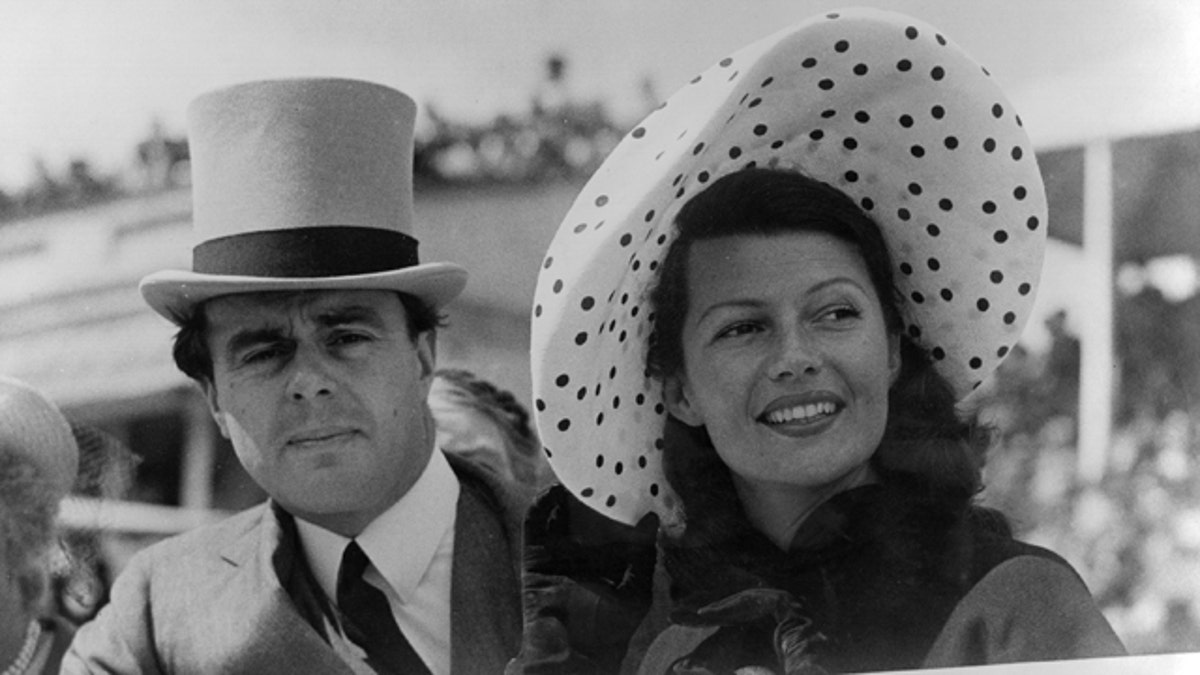 Prince Aly Khan (1911 - 1960) at Epsom races with his wife, Hollywood actress Rita Hayworth (1918 -1987). 