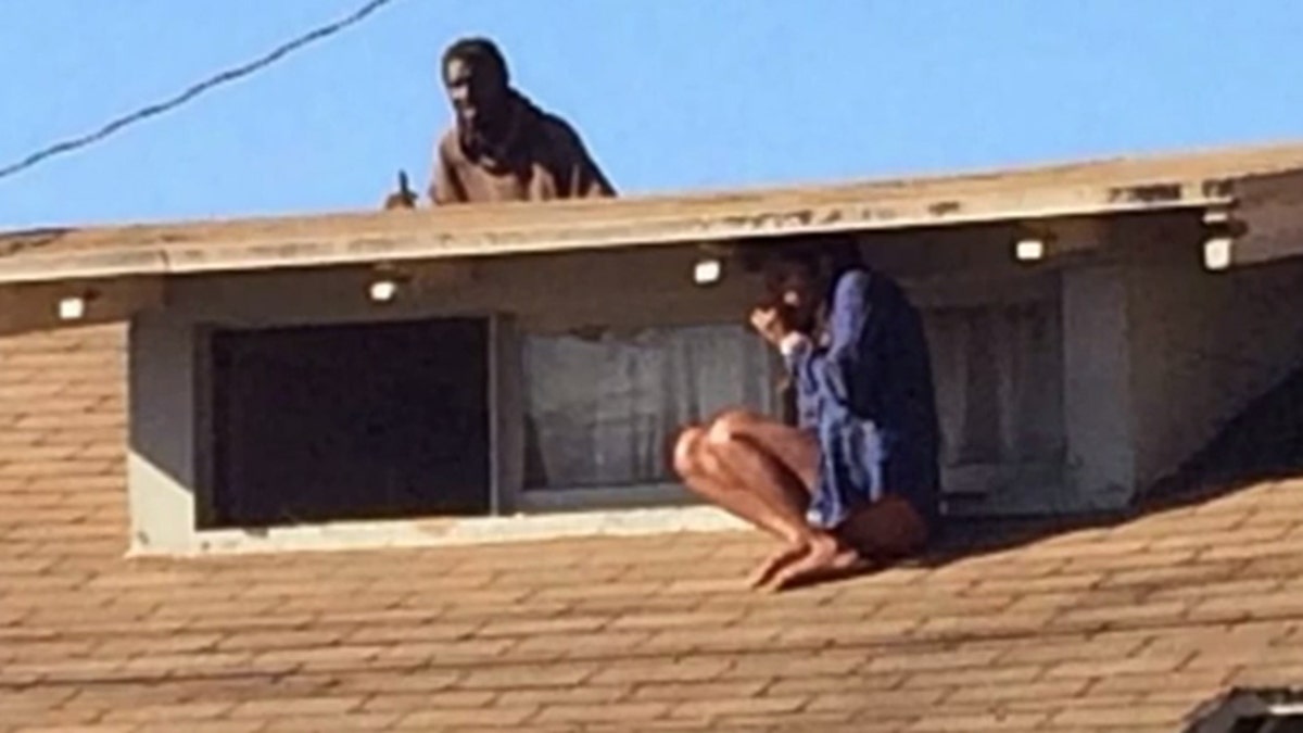 Half-naked woman flees to roof after deranged homeless man breaks into home  | Fox News