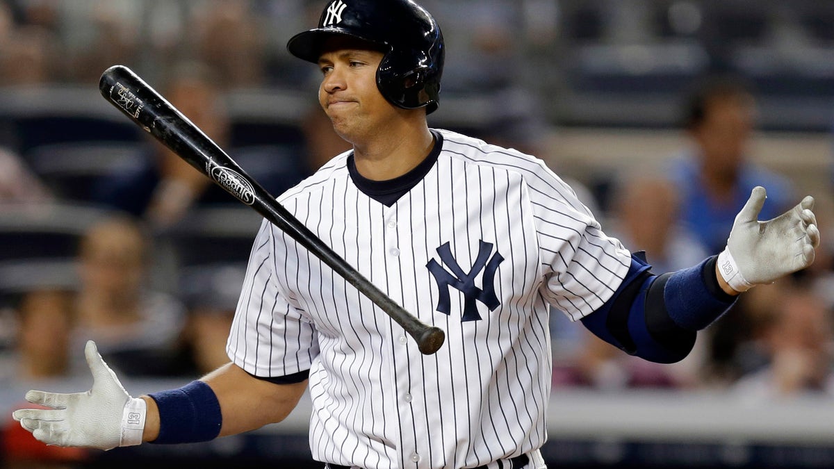 Archives - In archive photos from August 13, 2013, Alex Rodriguez of the New York Yankees reacted in the seventh inning baseball game against the New York Los Angeles Angels. Rodriguez accepted his season-long suspension of Major League Baseball, the longest fine in the sport's history to be associated with performance-enhancing drugs. Rodriguez withdraws lawsuits against MLB, Commissioner Bud Selig and the Players Association on Friday, February 7, 2014 to overturn his season-long suspension. (AP Photo/Kathy Willens, Archives)