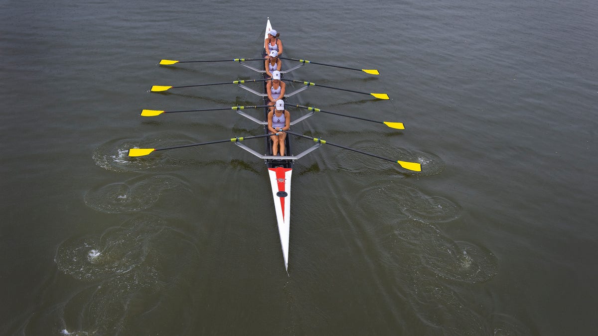 Members of the Vesper Rowing Club line up to compete in the 2012 National Rowing Championships at Cooper River in Cherry Hill, N.J., Saturday, July 14, 2012. (AP Photo/Camden Courier-Post, Jose F. Moreno) NO SALES; MANDATORY CREDIT