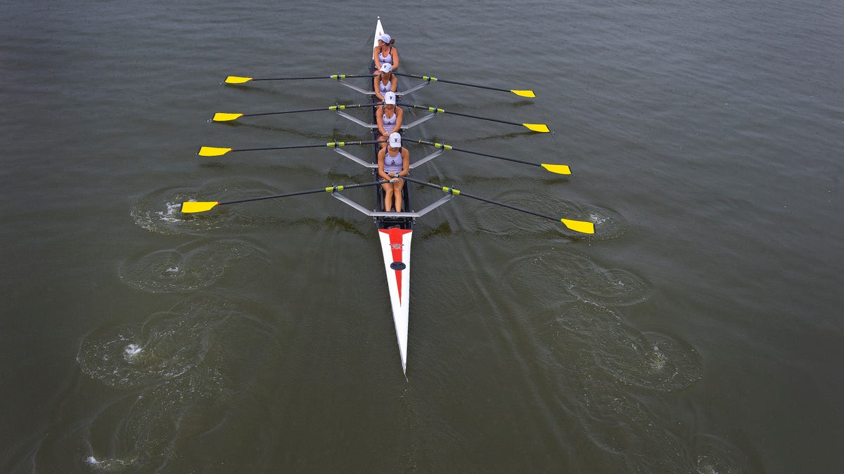 Members of the Vesper Rowing Club line up to compete in the 2012 National Rowing Championships at Cooper River in Cherry Hill, N.J., Saturday, July 14, 2012. (AP Photo/Camden Courier-Post, Jose F. Moreno) NO SALES; MANDATORY CREDIT