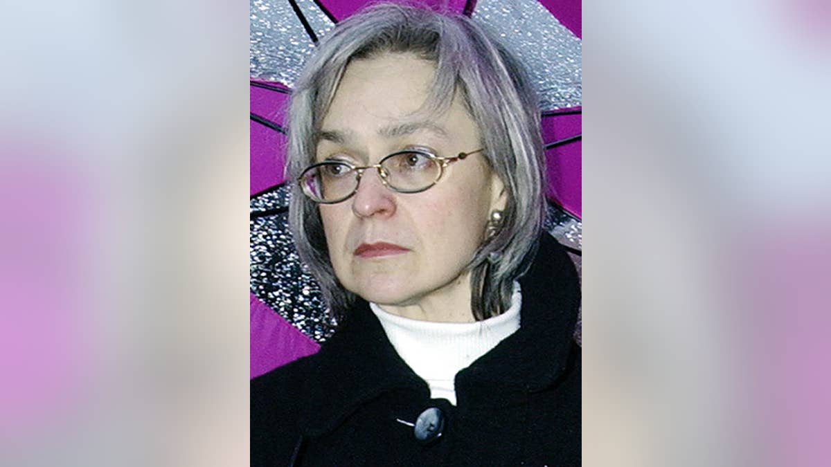 FILE - In this Oct. 2004 file photo reporter Anna Politkovskaya attends a rally against war in Chechnya in downtown Moscow, Russia. Prominent Russian opposition figure Boris Nemtsov’s killing follows the slaying over the past decade of several other high-profile critics of President Vladimir Putin and his policies. Renowned journalist Anna Politkovskaya, 48, was shot to death in the elevator of her Moscow apartment building in October 2006. Her work in the Novaya Gazeta newspaper was sharply critical of Kremlin policies in Chechnya and of human rights violations there. (AP Photo/Fyodor Savintsev, File)