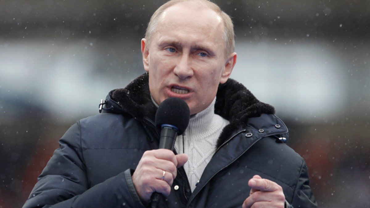 Feb. 23: Russian Prime Minister Vladimir Putin attends a massive rally in his support at Luzhniki stadium in Moscow, Russia. 