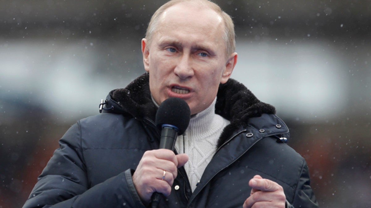 Feb. 23: Russian Prime Minister Vladimir Putin attends a massive rally in his support at Luzhniki stadium in Moscow, Russia.