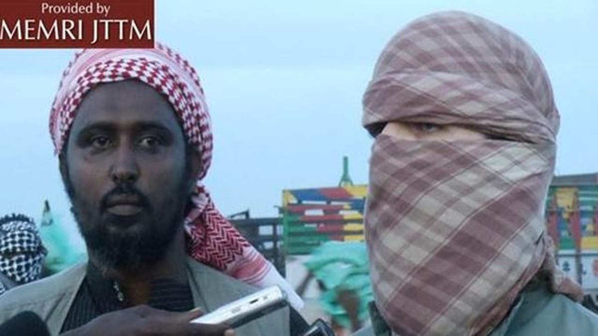 Oct. 14, 2011: Al-Shabaab spokesman Ali Mahmoud Rage, left, and Al Qaeda spokesman Abu Abdallah Al-Muhajir speak to reporters.