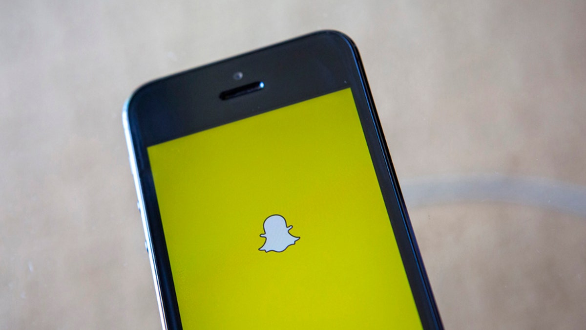 Snapchat logo on phone screen