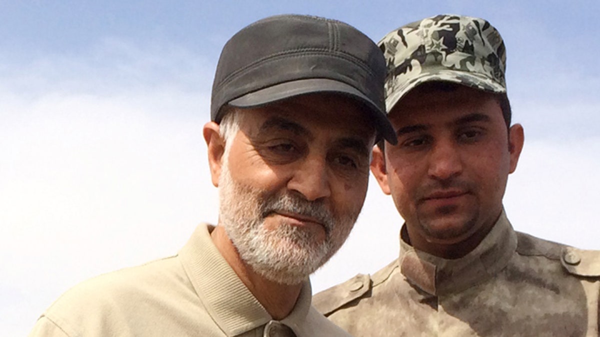 March 8, 2015: Gen. Qassem Soleimani, left, stands at the frontline during offensive operations against Islamic State militants in the town of Tal Ksaiba, Iraq.
